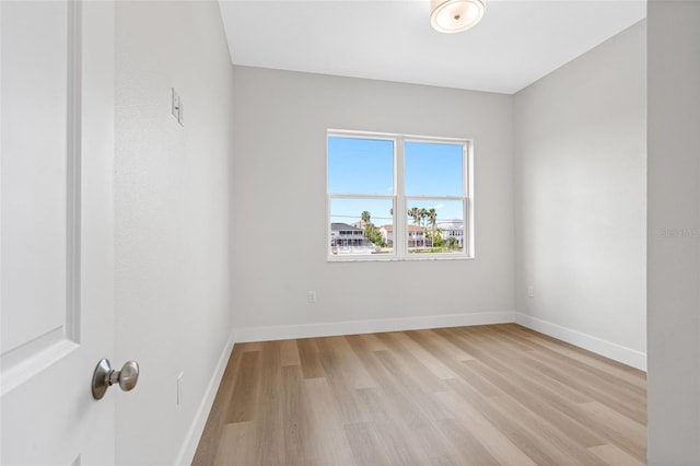 spare room with light hardwood / wood-style floors