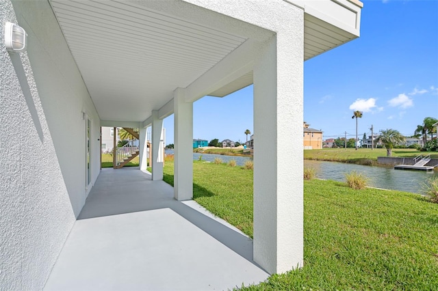 view of patio / terrace featuring a water view