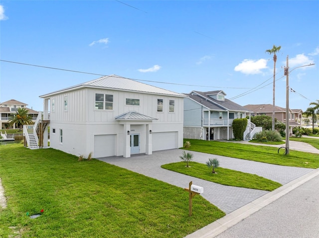 view of front facade featuring a garage and a front yard