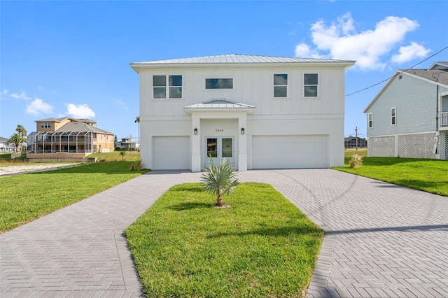 view of front of property with a garage and a front yard