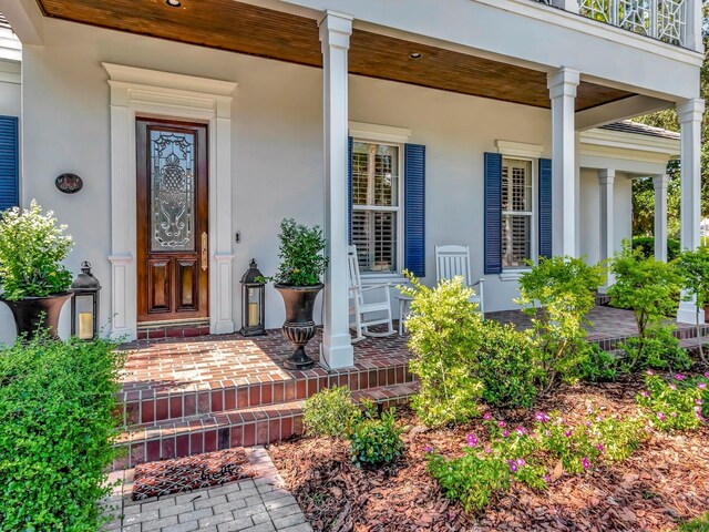 entrance to property with a porch