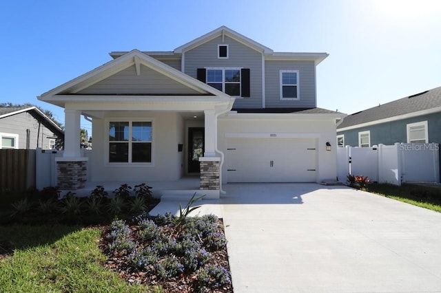 view of front of house with a garage and a porch