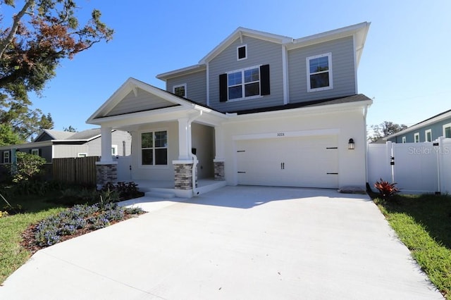 view of front of house with a garage and covered porch