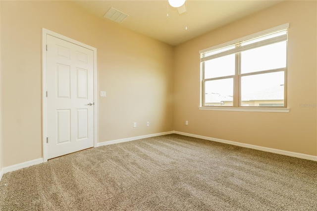 406 Tortosa Ct, Davenport, FL 33837 - unfurnished room featuring carpet flooring, a ceiling fan, and baseboards