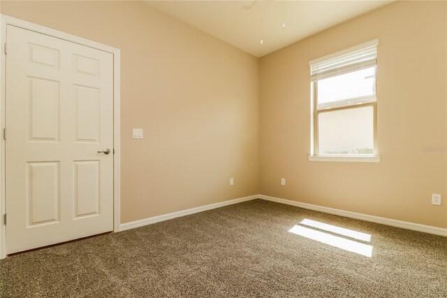 406 Tortosa Ct, Davenport, FL 33837 - empty room featuring carpet flooring, baseboards, and ceiling fan