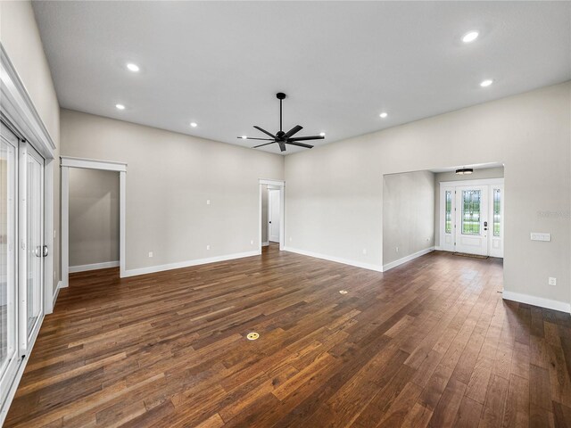 unfurnished living room featuring wood-type flooring and ceiling fan