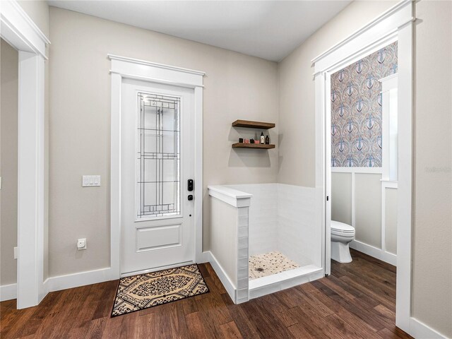 foyer with dark hardwood / wood-style floors