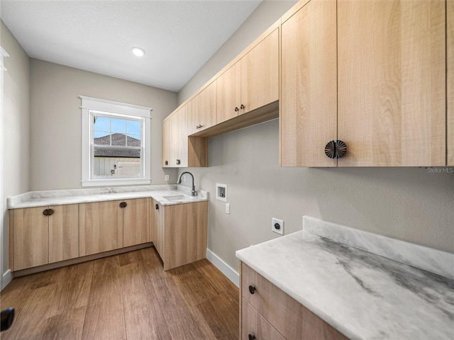 clothes washing area featuring dark hardwood / wood-style flooring, sink, electric dryer hookup, cabinets, and washer hookup