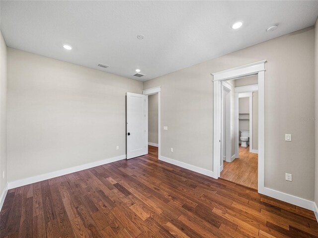 unfurnished bedroom with hardwood / wood-style floors