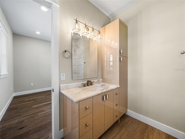 bathroom featuring vanity and hardwood / wood-style flooring