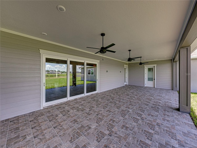 view of patio featuring ceiling fan