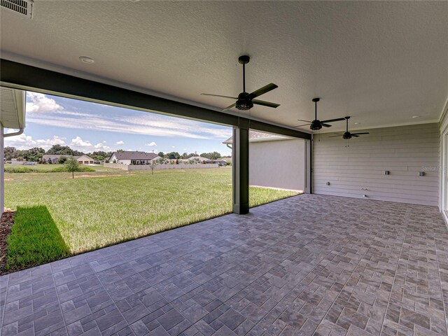 view of patio featuring ceiling fan