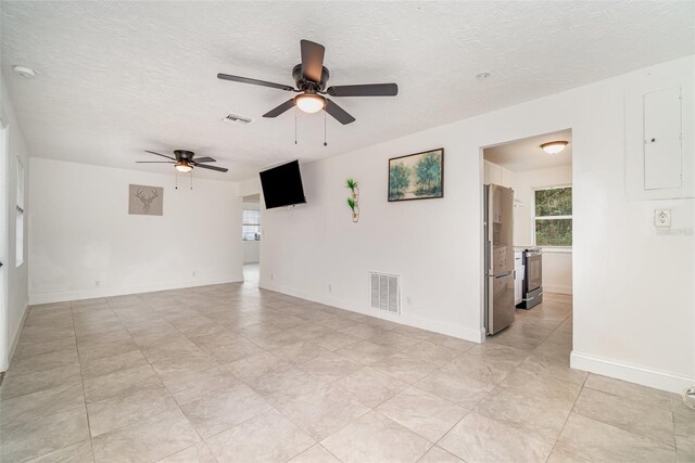 21 Cabana Ave, North Fort Myers, FL 33903 - unfurnished room with plenty of natural light, visible vents, and a textured ceiling