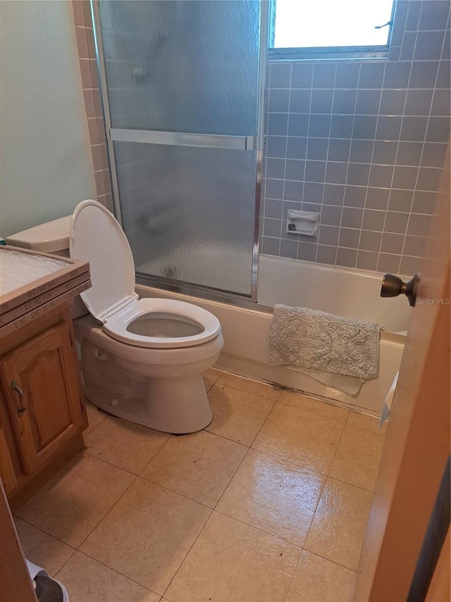 bathroom with tile patterned flooring, toilet, and vanity