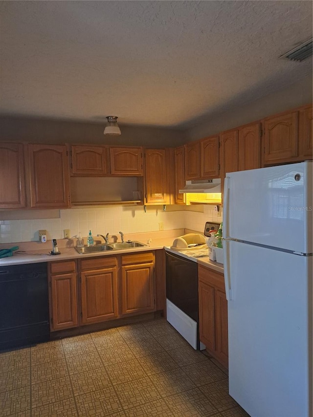 kitchen featuring sink, tile patterned floors, backsplash, and white appliances