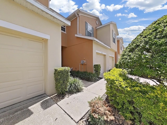 view of property exterior with a garage