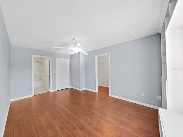 spare room with hardwood / wood-style flooring and ceiling fan