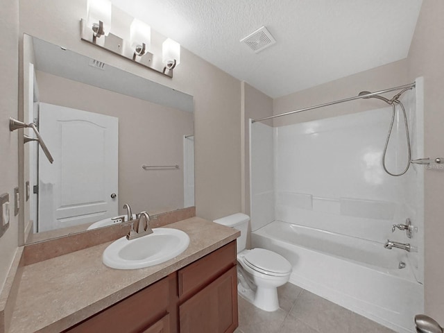 full bathroom featuring shower / bathing tub combination, vanity, a textured ceiling, tile patterned floors, and toilet