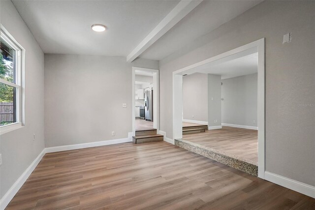 unfurnished room featuring hardwood / wood-style floors