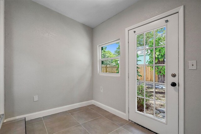 entryway with tile patterned floors