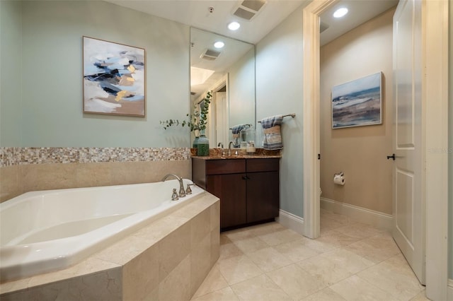 full bathroom with a bath, vanity, visible vents, and tile patterned floors