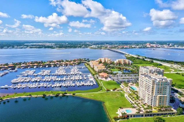 birds eye view of property featuring a water view and a view of city