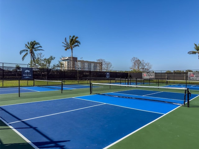 view of sport court featuring fence