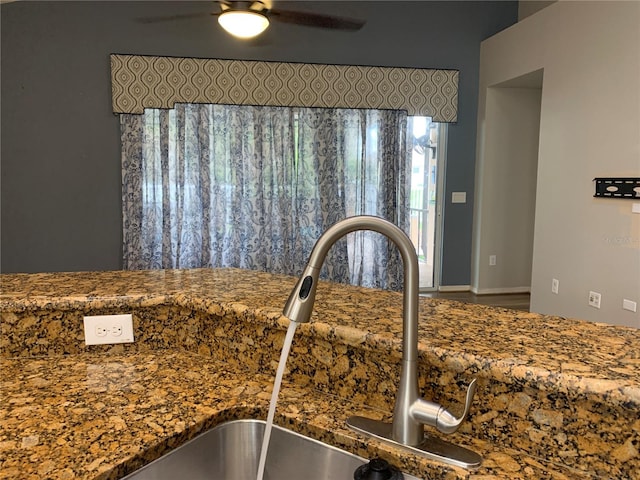 room details featuring ceiling fan and sink