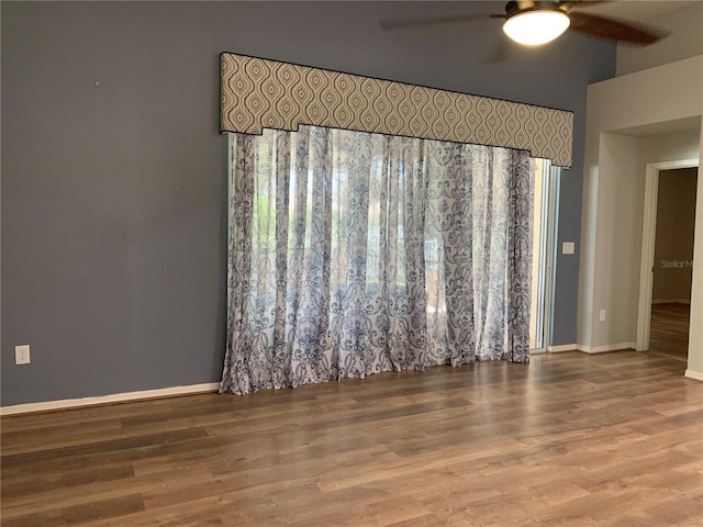 spare room with ceiling fan and hardwood / wood-style floors