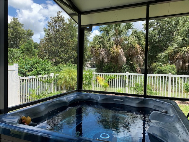 view of pool with a hot tub