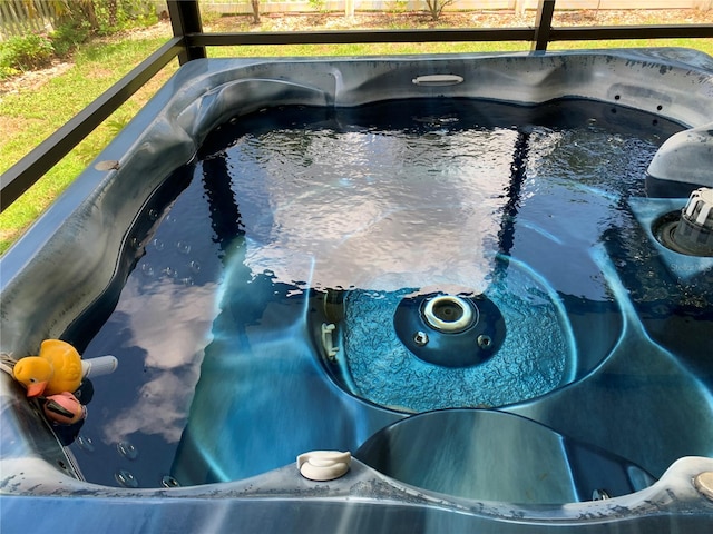 view of pool featuring a hot tub and sink