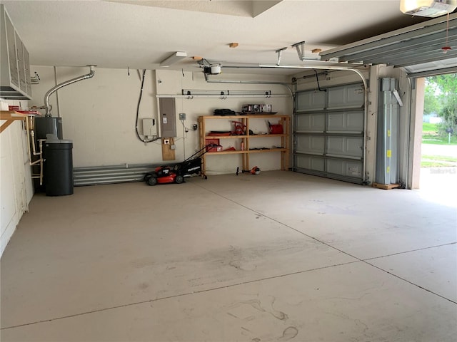 garage with a garage door opener and electric panel