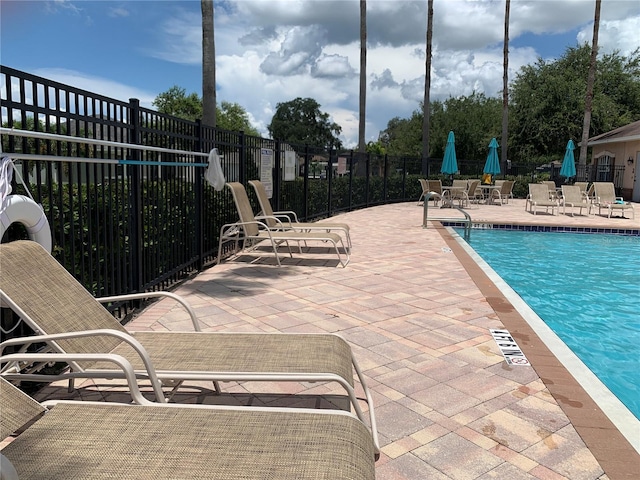 view of swimming pool featuring a patio area