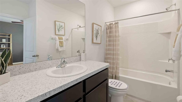 full bathroom featuring toilet, vanity, and shower / bath combination with curtain