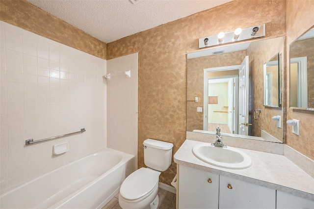 full bathroom featuring vanity, shower / bath combination, a textured ceiling, and toilet