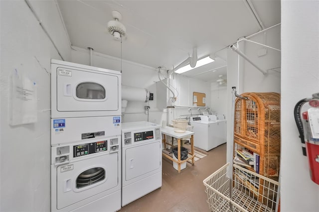 clothes washing area featuring stacked washer and clothes dryer and washer and clothes dryer