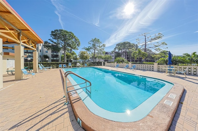 view of swimming pool with a patio area