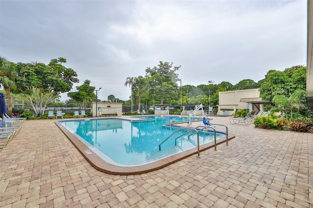 view of swimming pool featuring a patio area