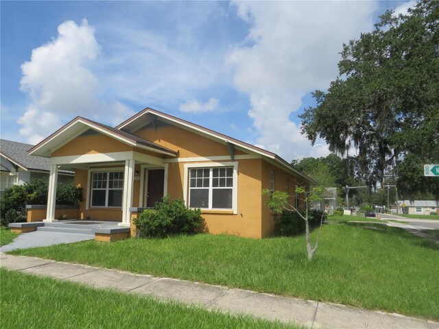 view of front of property with a front lawn