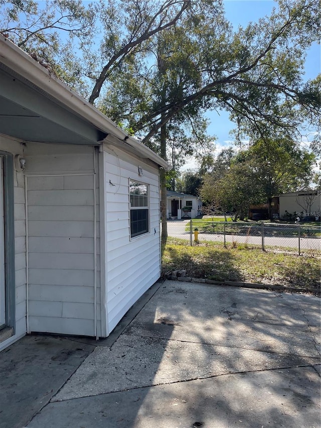 view of side of property with a patio area