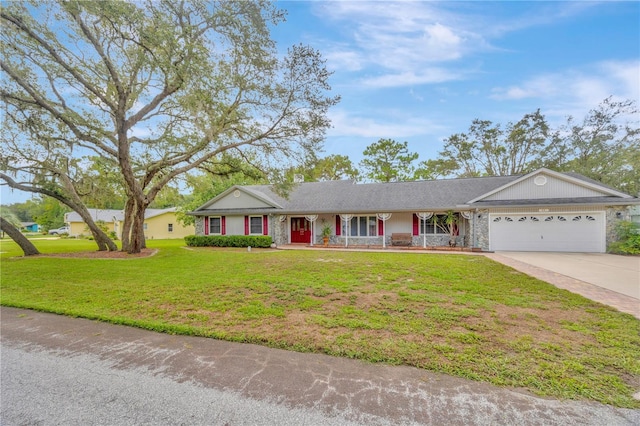 ranch-style home with a garage and a front lawn