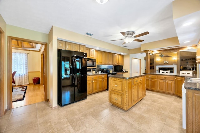 kitchen with sink, a center island, kitchen peninsula, ceiling fan, and black appliances