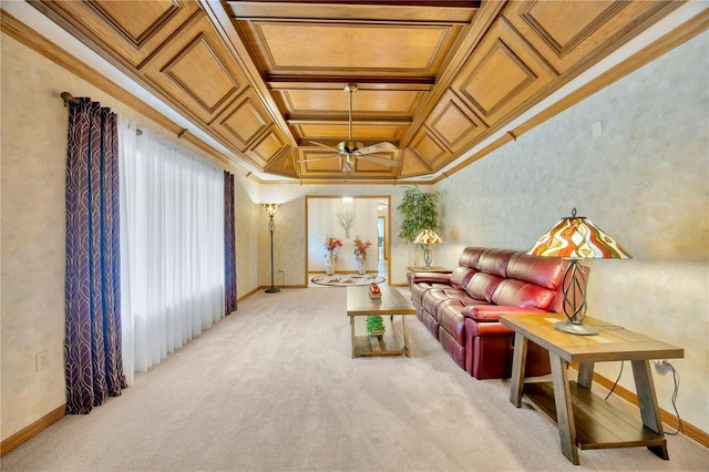 carpeted living room featuring ornamental molding, coffered ceiling, and ceiling fan