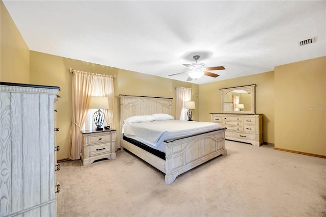 bedroom with light colored carpet and ceiling fan