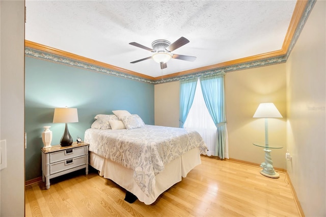 bedroom with ornamental molding, ceiling fan, a textured ceiling, and light hardwood / wood-style floors