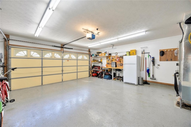 garage featuring a garage door opener and white fridge