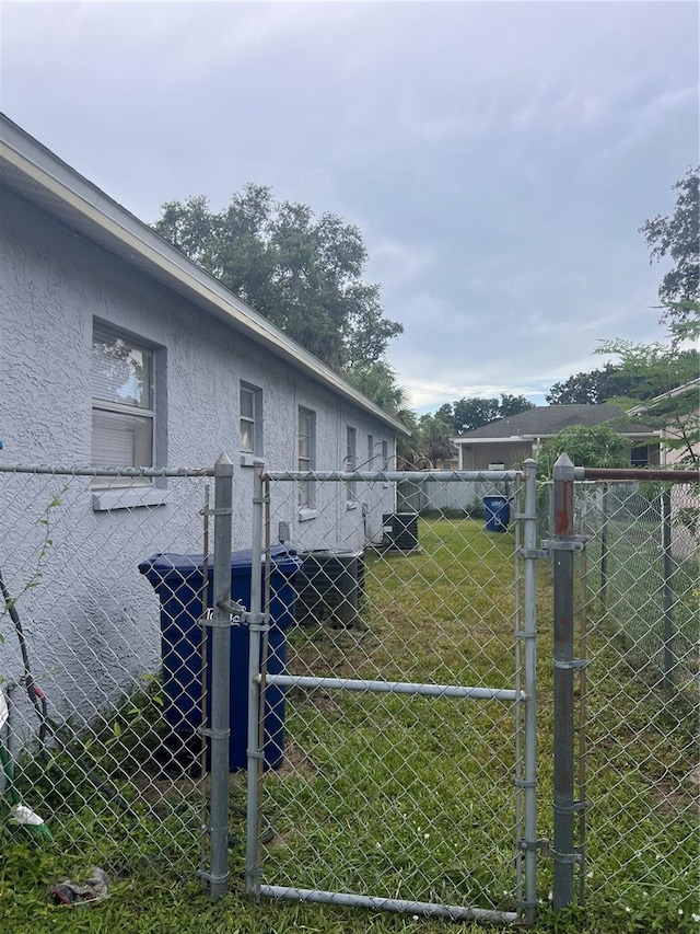 view of gate with fence