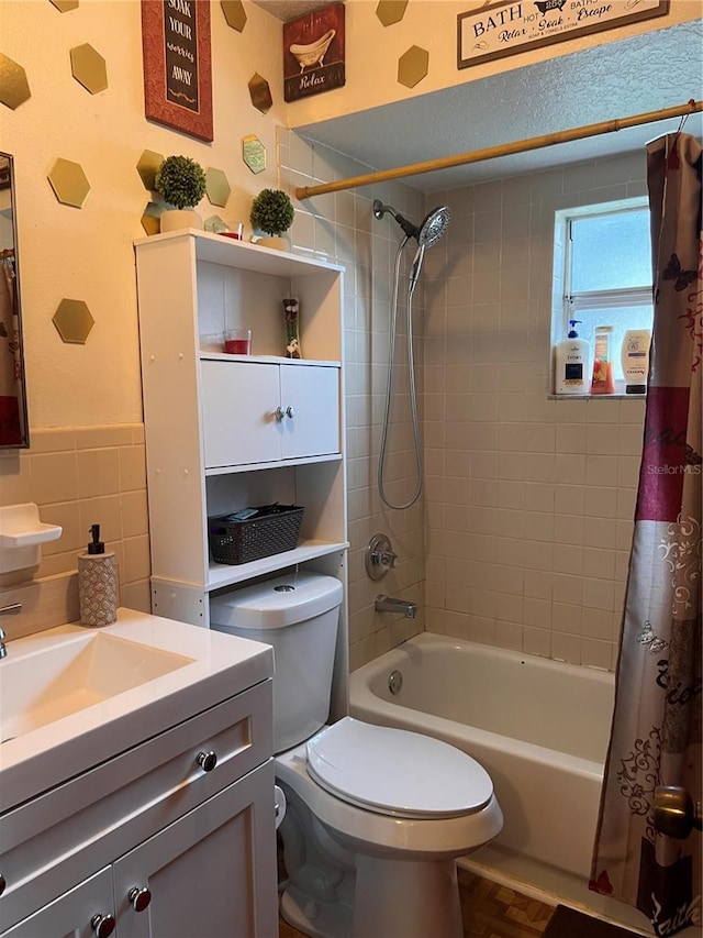 full bath featuring shower / bath combo, vanity, and toilet