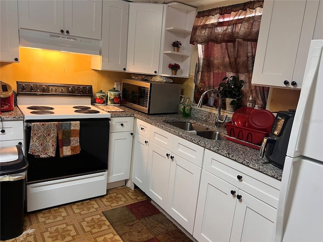 kitchen featuring under cabinet range hood, white appliances, a sink, white cabinetry, and light floors