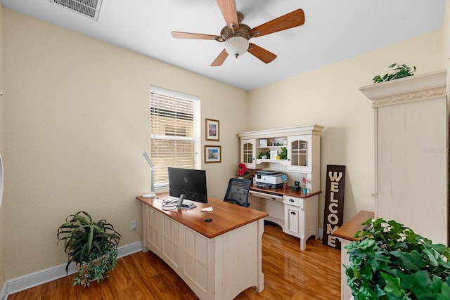 office area featuring wood-type flooring and ceiling fan